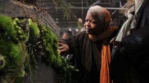 A woman participates in a sensory tour of the Philadelphia Flower Show.