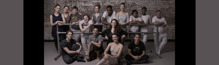 ST Kats Day School & PA Ballet II Group Photo. All are posing by around a ballet bar in the Studio