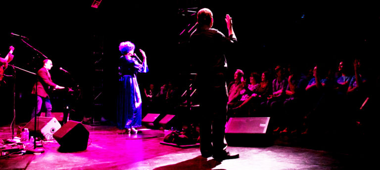 The Back of Martha GrahamCracker signing to Audience at FringeArts