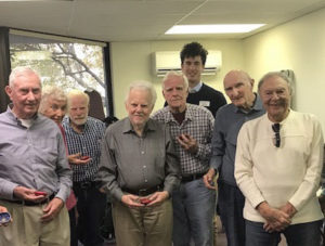 Older Gentlemen from Alzheimers Association posing together at their Bollywood dance lesson