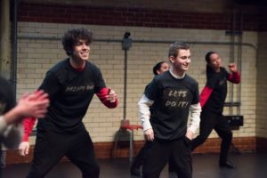 Justin Morrisey and fellow dancers performing a tap performance