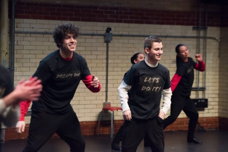 Justin Morrisey and fellow dancers performing a tap performance