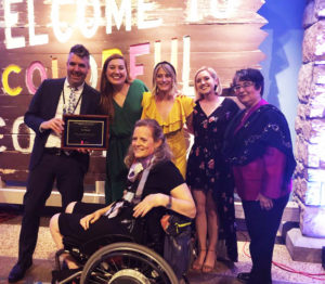 The Art-Reach Staff poses with Betty Siegel, the Director of the Office of VSA & Accessibility, and our Community Asset Award. We are smiling SO HARD !