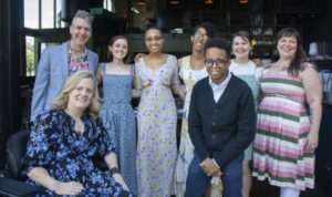 the Art-Reach staff, a group of eight people, posing comfortably