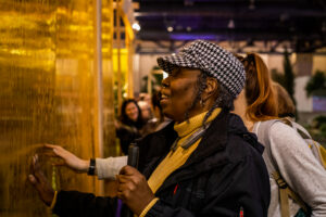 blind woman touching artwork